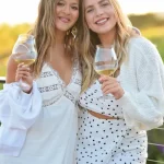 Two friends enjoying a glass of Coursey Graves wine together