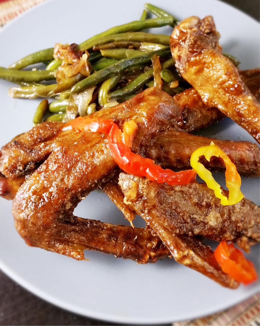 Twice cooked crispy duck wings with sticky sweet glaze